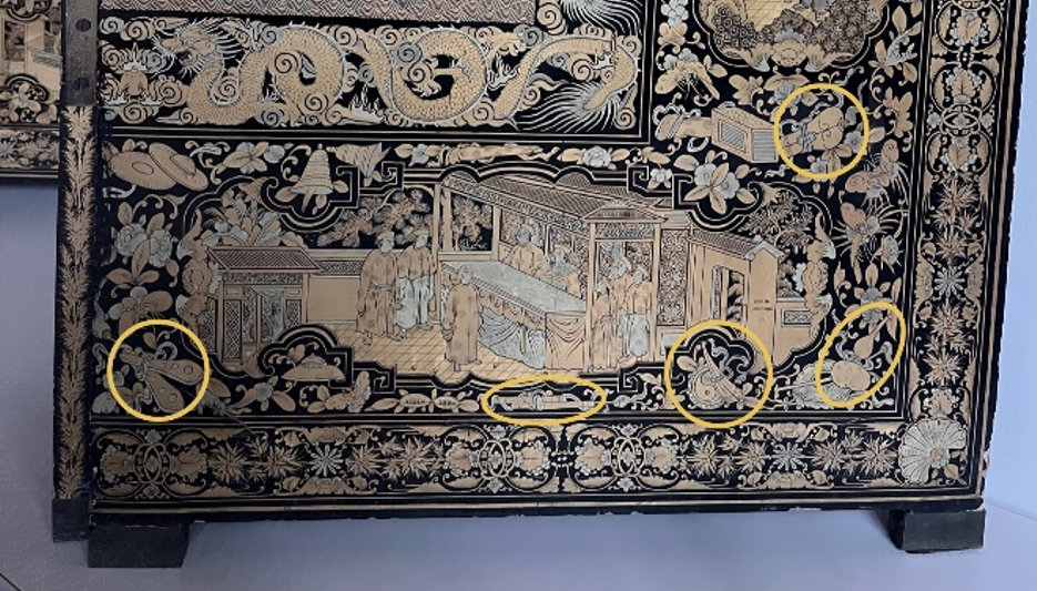 Detail photo of the screen highlighting the ritual tools which represent the eight immortals in Daoism. Five tools are circled