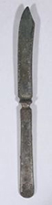 a silver butter knife from Merion Hall