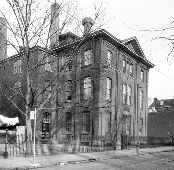 Photograph of the Institute for Colored Youth. The building is three stories tall and is a rather plain building. 